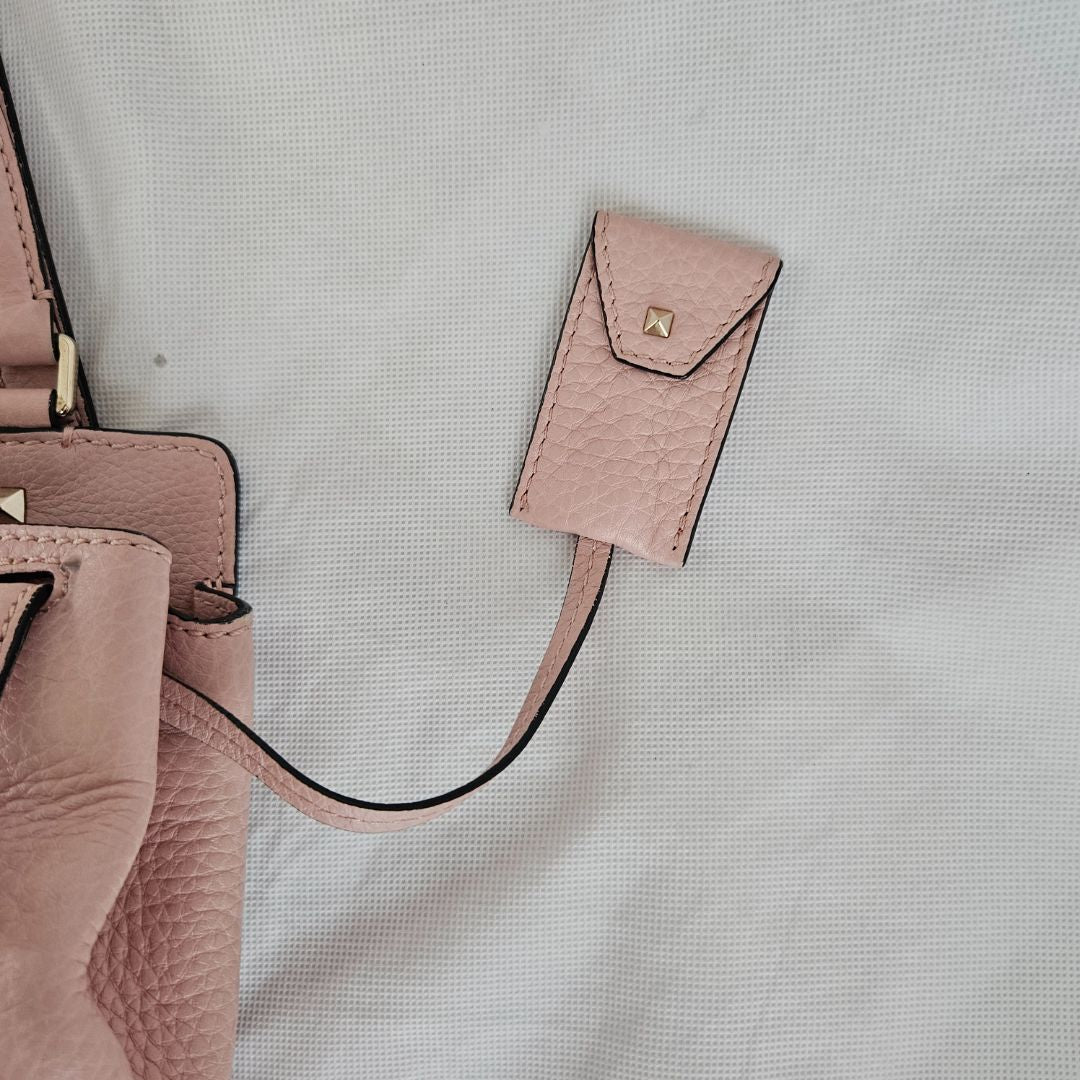Valentino pink textured leather crossbody flap bag with lock