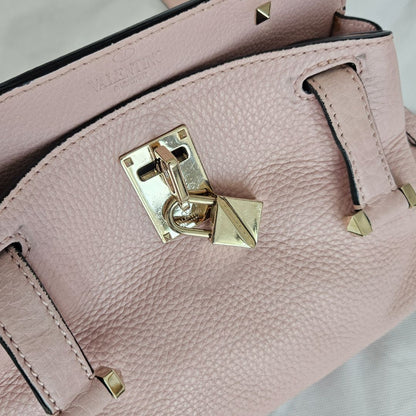 Valentino pink textured leather crossbody flap bag with lock