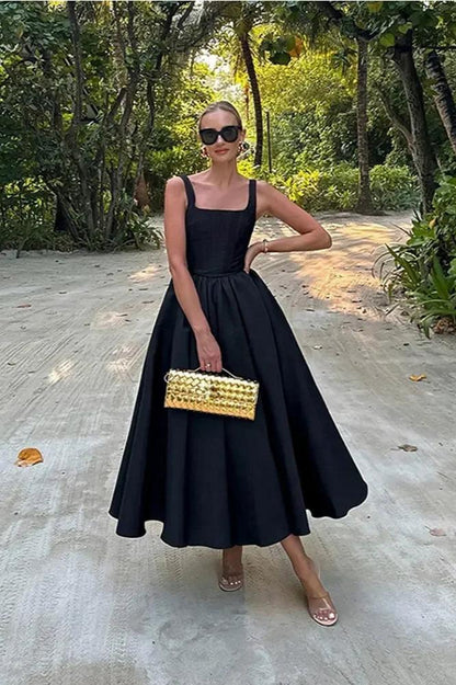 Off Shoulder Black Dress With Flowing Skirt