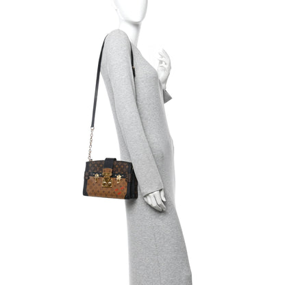 Reverse Monogram Trunk Clutch