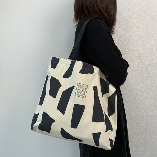 Zippered Canvas Handbag With Artistic Design