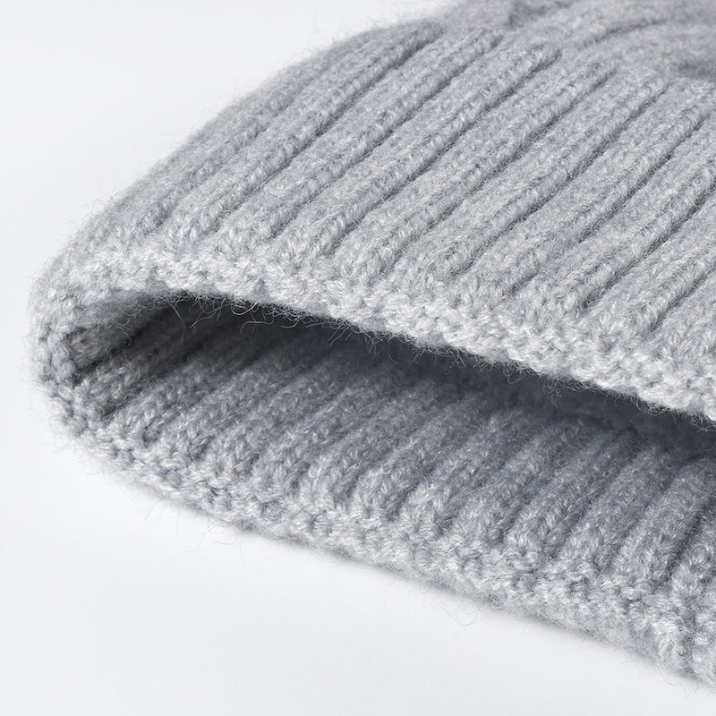 Splicing Twist Padded Knit Pom Beanie