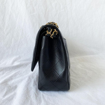 Chanel black jumbo caviar classic flap bag