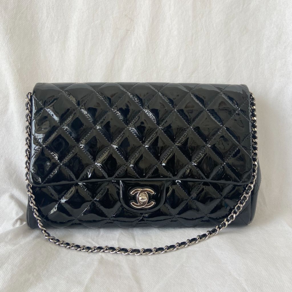 Chanel black quilted patent leather flap bag