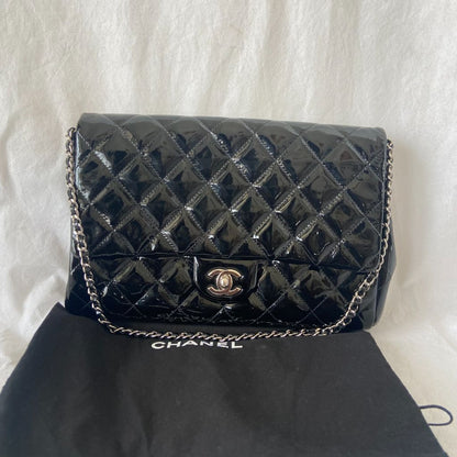 Chanel black quilted patent leather flap bag