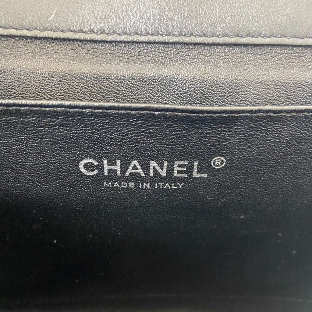 Chanel black quilted patent leather flap bag