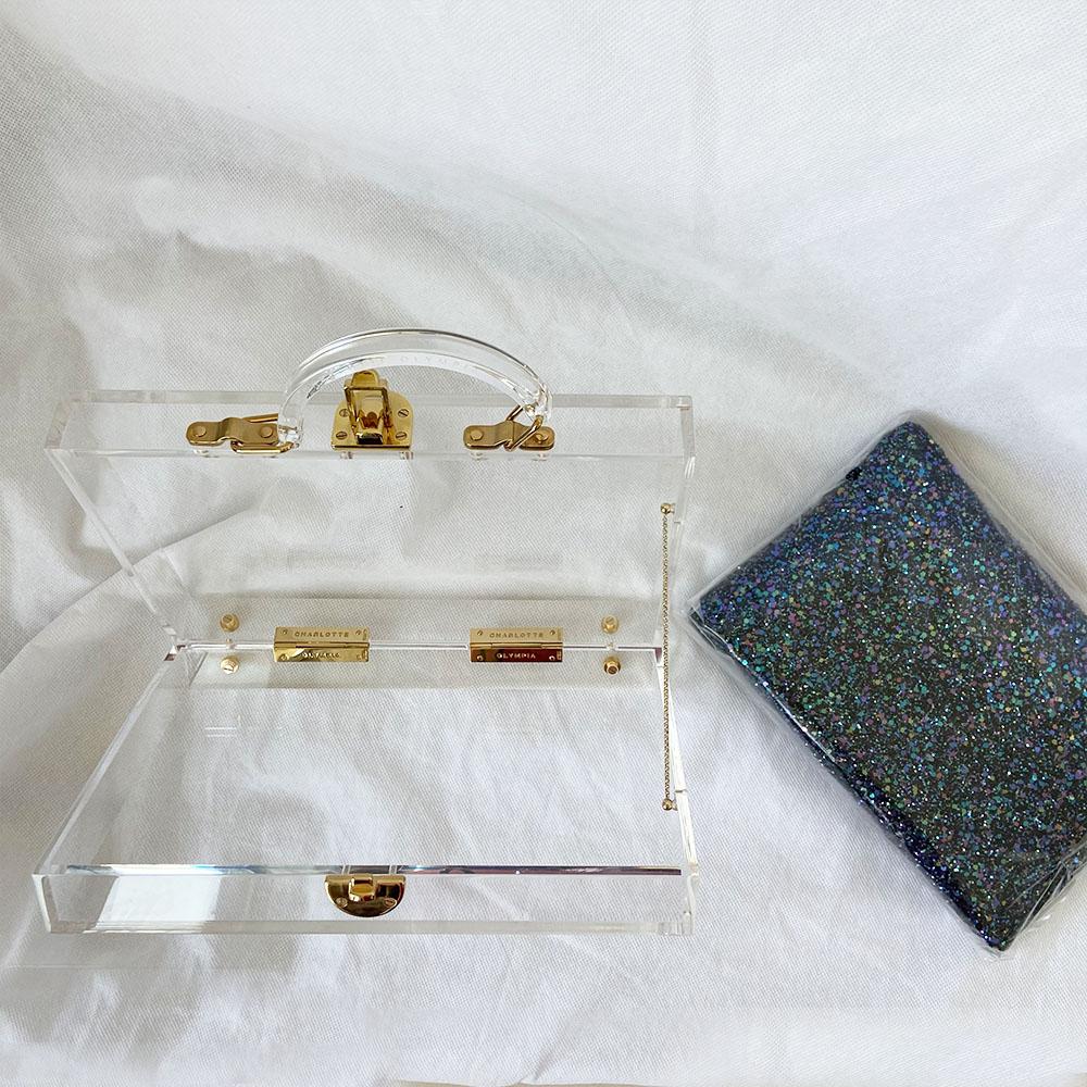Charlotte Olympia clear acrylic box clutch with blue glittery zip pouch