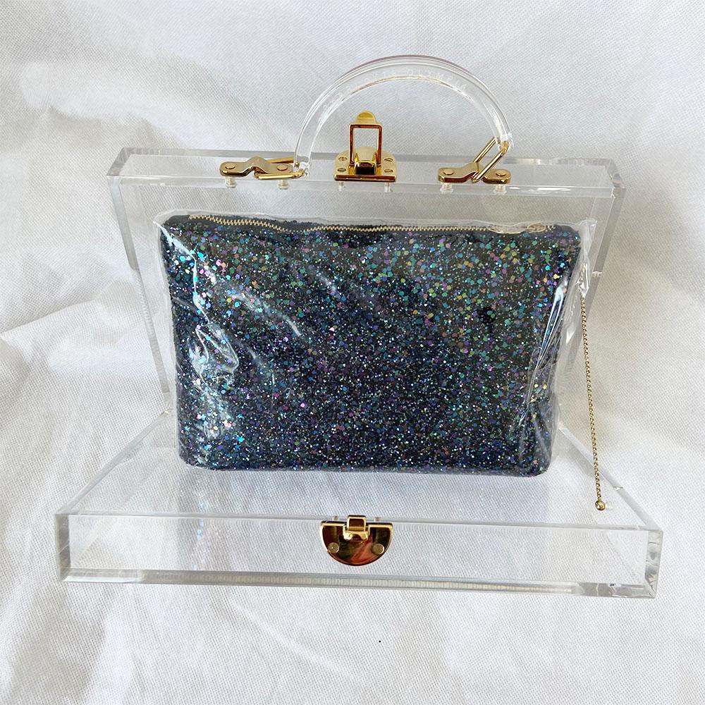 Charlotte Olympia clear acrylic box clutch with blue glittery zip pouch