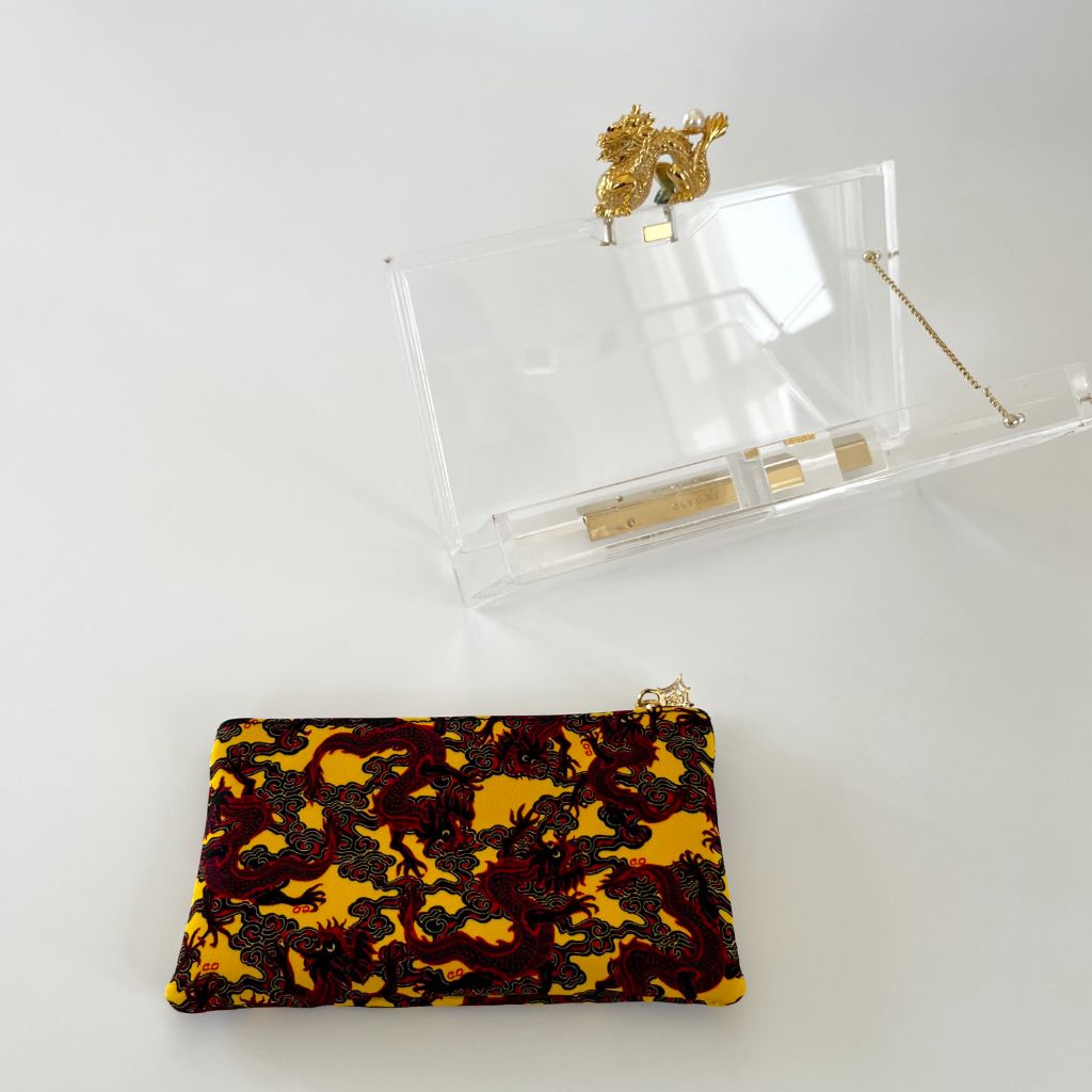 Charlotte Olympia clear plexi clutch with dragon lock