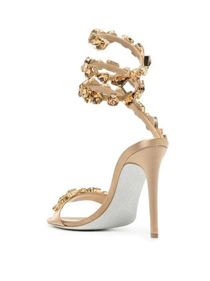 Elyra Snake Rhinestone Sandals In Gold