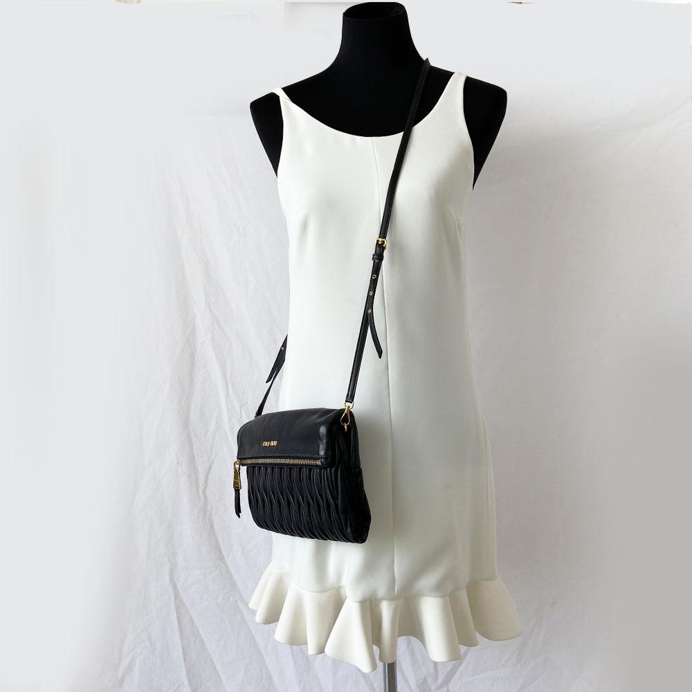 Miu Miu black leather matelasse fold over clutch bag