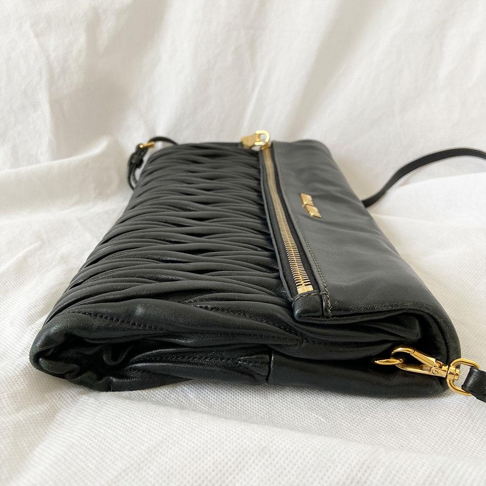 Miu Miu black leather matelasse fold over clutch bag