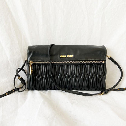 Miu Miu black leather matelasse fold over clutch bag