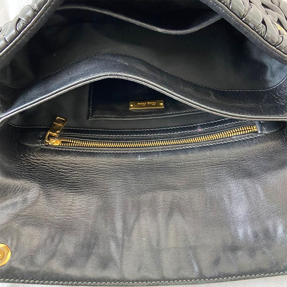 Miu Miu black leather matelasse fold over clutch bag